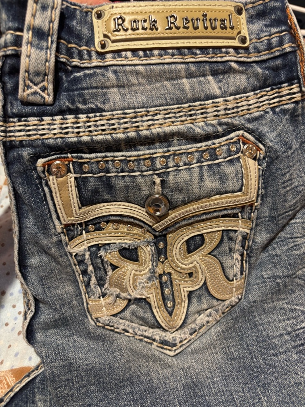 Rock Revival Women's Faded Blue Jeans with Beige Embroidery and rhinestones